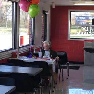 a woman sitting at a table