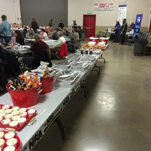 people sitting at tables with food