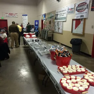 a long table of cupcakes