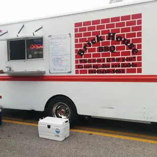 a man standing in front of a food truck