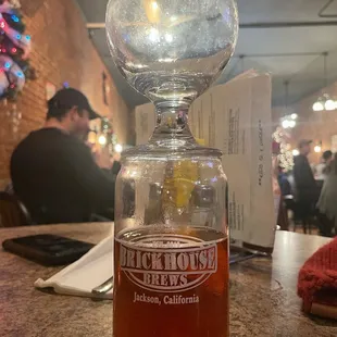 a glass of beer on a table