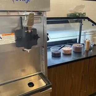 Ice cream machine with self-serve toppings.