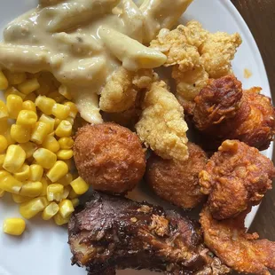 First plate.  Macaroni Cheese. Fried Catfish Meal. Hushpuppies. Hot Fried Chicken Meal. BBQ Ribs Meal. Corn cause I need at least a veggie.