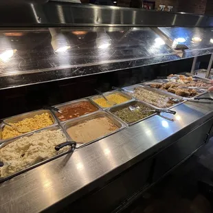 a buffet with a variety of food items