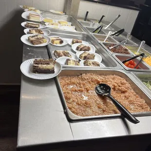 a buffet with a variety of food items