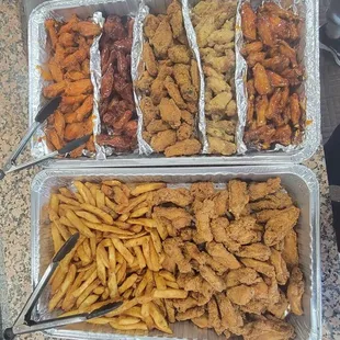 Catering tray of fresh chicken wings with different flavors