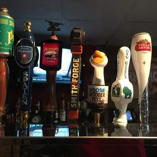 a row of beer taps