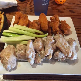 chicken wings, celery, and fries