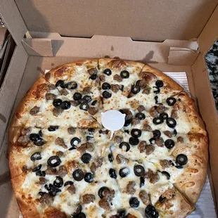 A medium olive oil sausage and black olives