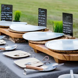 a table set with plates and utensils