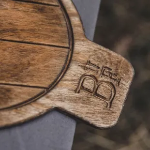 a wooden pizza board