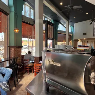 a man sitting at a table in a coffee shop