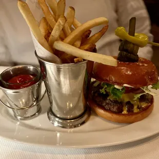 a burger and fries on a plate