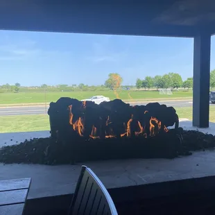 Large fire place outside! There are also heaters under the tables!