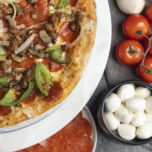 a pizza with mushrooms and peppers