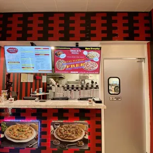 a view of a pizza counter