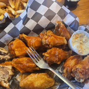 AMAZING Buffalo wings with homemade blue cheese dipping sauce and Cajun fries.