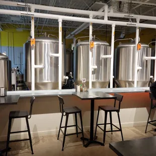 a row of stainless steel tanks