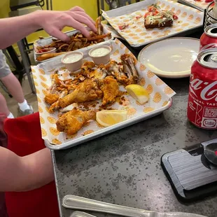 Carnage!  Super yummy wings and pizza!