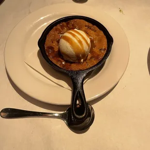 a skillet with a scoop of ice cream