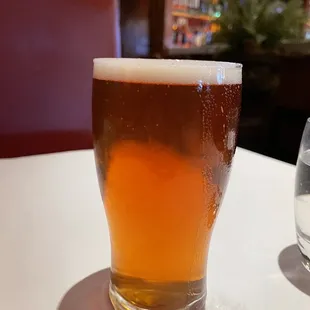 a glass of beer on a table