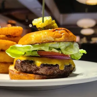 Cheeseburger with onion ring side.