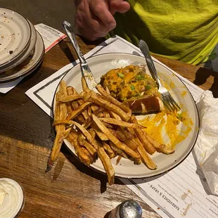 a plate of food with fries