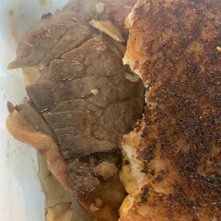 Braised brisket grilled cheese. The meat barely has any taste and is drenched in apple butter.