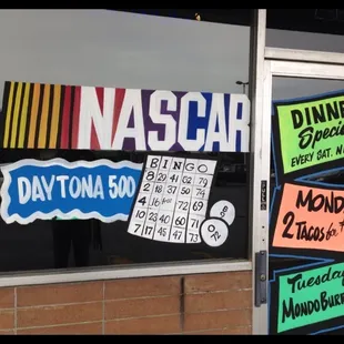 a window with a sign that says nascar