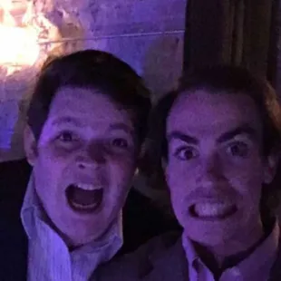 two men in suits and one is surprised