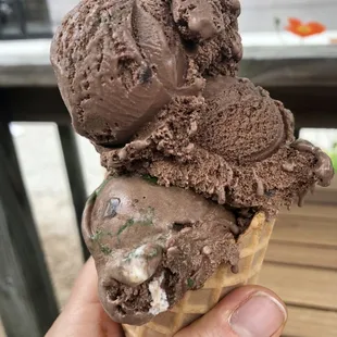 Chocolate mint brownie regular scoop in a waffle cone