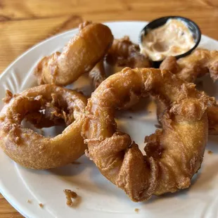 Delicious fatty onion rings. Can't really tell but they are really big.