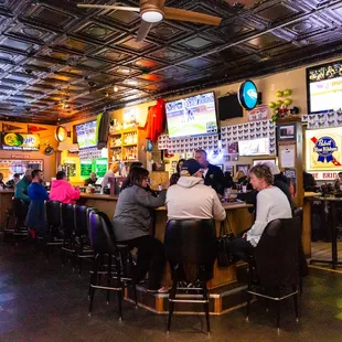 people sitting at the bar