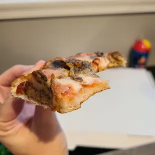 Not thin and crackery but not doughy. Fantastic crust!