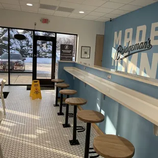 a long bar with stools