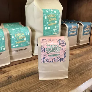 various bags of coffee on a shelf