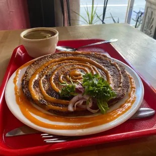 Woh (a lentil-based pancake) stuffed with tofu and mushrooms