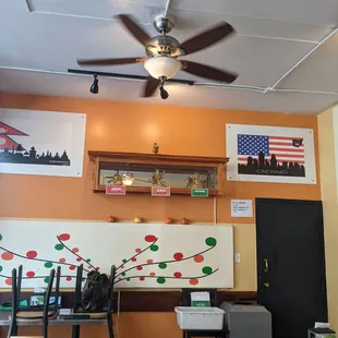 the dining area with a ceiling fan