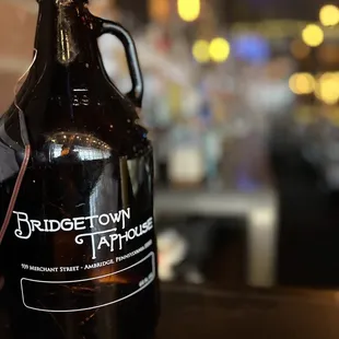 a growl of beer on a table