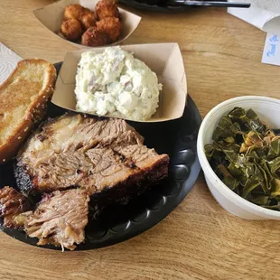 Brisket, potato salad and collard greens