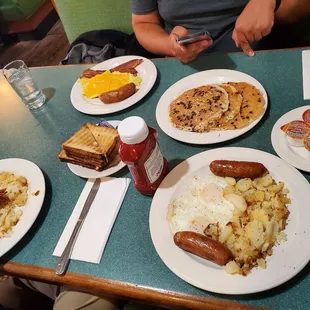a table full of breakfast foods