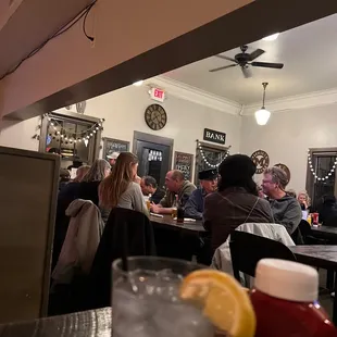 people sitting at a bar