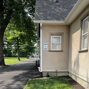 Parking is around the back of the building. Entrance is at the front.