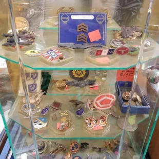 Military medals and pins for sale.