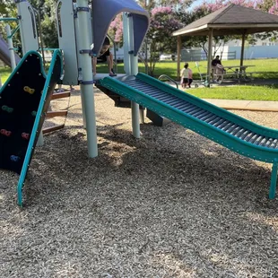 Little kid playground set with roller slide