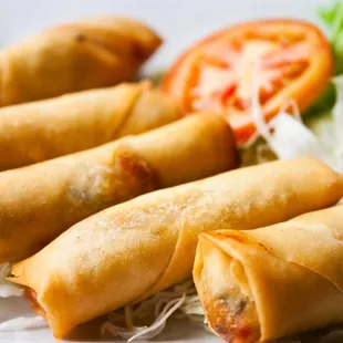 a plate of vegetable spring rolls