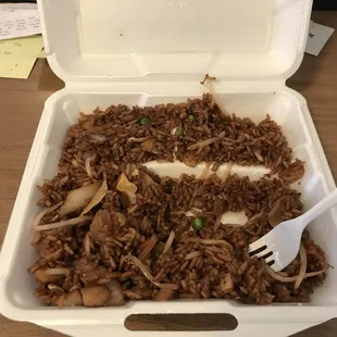 a fork in a takeout container