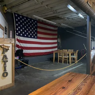 a large american flag hanging from the ceiling