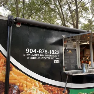 a food truck parked in a park