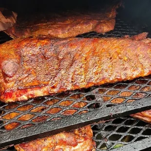 ribs cooking on a grill